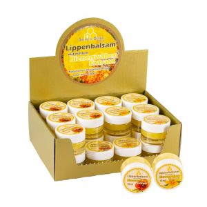 Goldener Aufsteller mit 24 Lippenbalsam Gläschen á 15 ml im rundem Glastöpfchen offen mit proben draußen