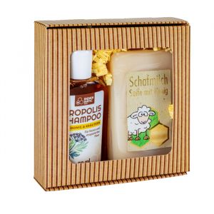 Geschenkset bestehend aus einer Seife mit Schafmilch und Honig, sowie eniem Akazien-Honig Haarshampoo gepackt mit hellem Sizzle in braunem Geschenkkarton mit Sichtfenster
